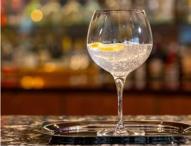 Alaska's ice cocktail made with authentic Alaska glacier ice harvested by state permit among floating glacier bergs in Prince William Sound and prepared to the highest standard under Alaskan authority