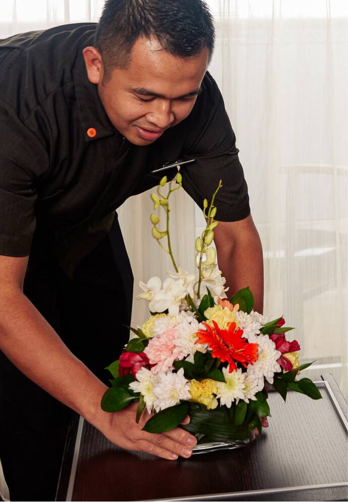 Man arranging flowers